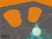 Screenshot of using mat_wireframe of two cylinders: the left one is a world brush, and causes bad triangles; the right one is a detail brush and causes no problems.